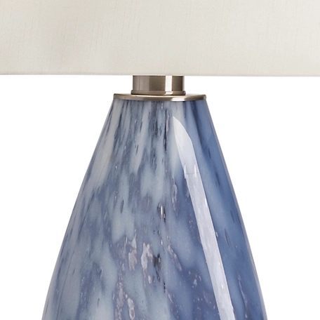A blue and white glass lamp.