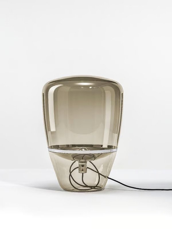 A hand-blown glass table lamp.